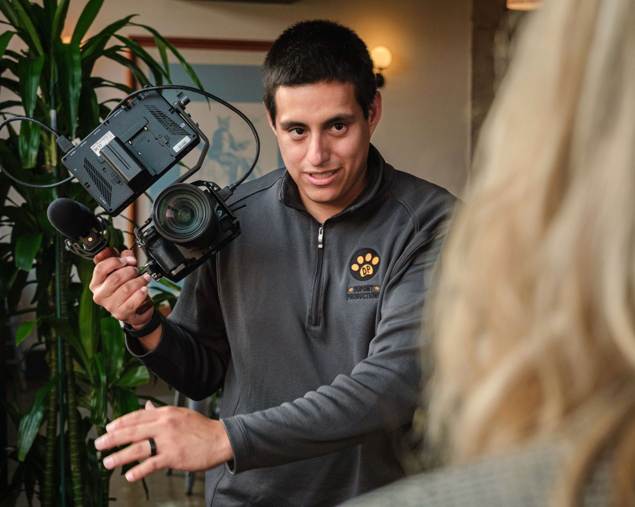 Will Dupont prepping a camera for an interview shoot